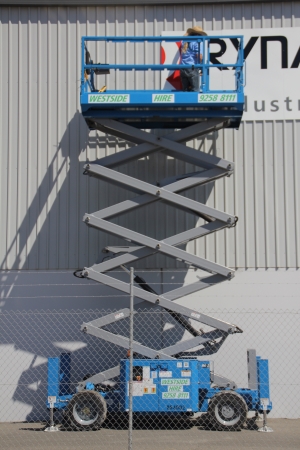 Westside Hire image of scissor lift in use.